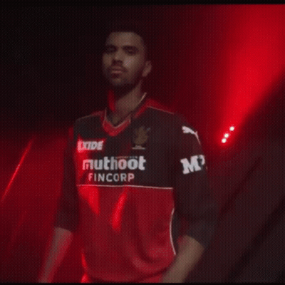 A Man Wearing A Shirt That Says Exide Muhoot Fincorp GIF