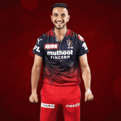 A Man Wearing A Shirt That Says Exide Muthoot Fincorp On It GIF