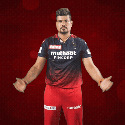 A Man Wearing A Shirt That Says Exide Mutuoot Fincorp GIF