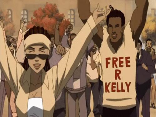 A Man Wearing A Shirt That Says " Free R Kelly " GIF