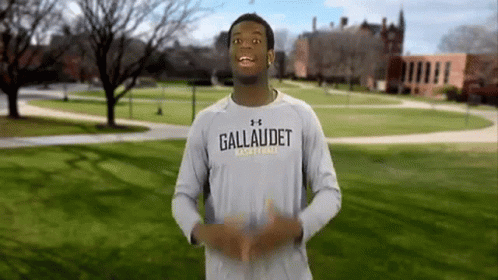 A Man Wearing A Shirt That Says Gallaudet Basketball On It GIF