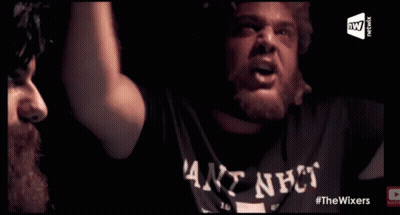 A Man Wearing A Shirt That Says ' Goat Shit ' On It Is Playing Poker GIF