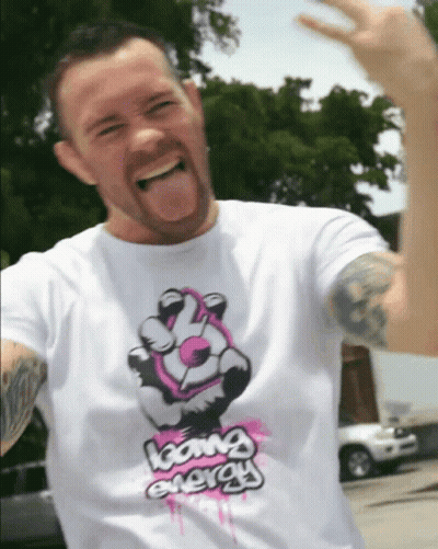 A Man Wearing A Shirt That Says Going Energy GIF