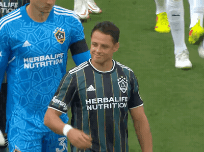 A Man Wearing A Shirt That Says Herbalife Nutrition On It GIF