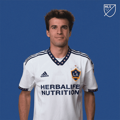 A Man Wearing A Shirt That Says Herbalife Nutrition On It GIF