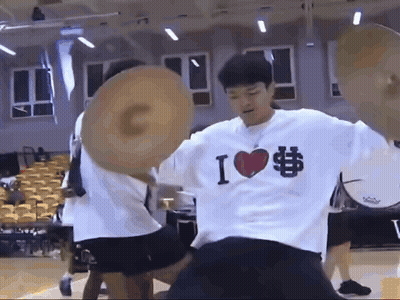 A Man Wearing A Shirt That Says I Love Basketball Is Holding A Basketball GIF
