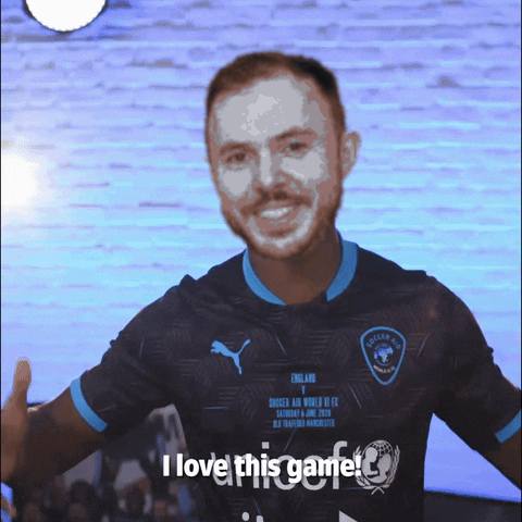 A Man Wearing A Shirt That Says I Love This Game On It GIF
