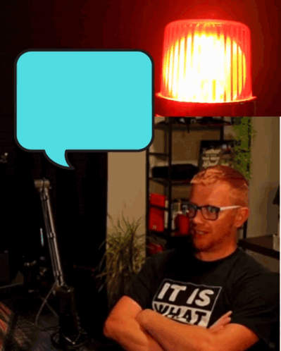 A Man Wearing A Shirt That Says " It Is What " GIF