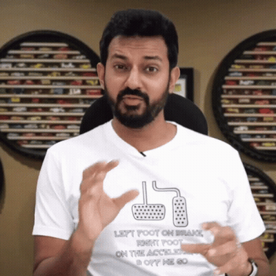 A Man Wearing A Shirt That Says Left Foot On Brake Right Foot On The Accelerator GIF