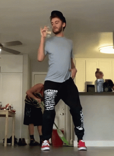 A Man Wearing A Shirt That Says Lefthand Is Standing In A Kitchen GIF