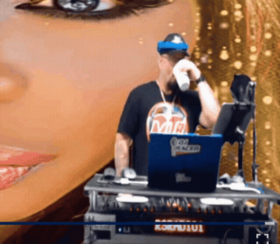 A Man Wearing A Shirt That Says Mr. Racer Stands In Front Of A Laptop GIF