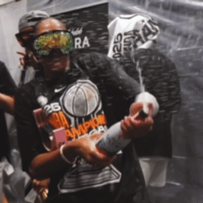 A Man Wearing A Shirt That Says Nba Champions On It GIF