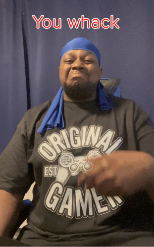 A Man Wearing A Shirt That Says " Original Gamer " GIF
