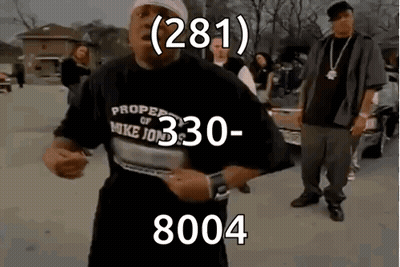 A Man Wearing A Shirt That Says Proper Of Mike Jones Is Dancing In A Parking Lot . GIF