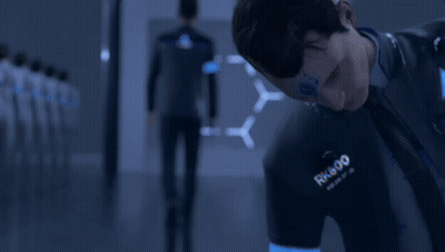 A Man Wearing A Shirt That Says Rk800 Is Looking Down GIF