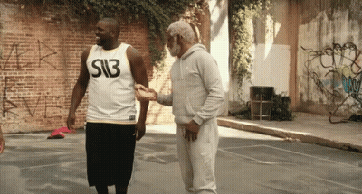 A Man Wearing A Shirt That Says S13 Shakes Hands With Another Man GIF