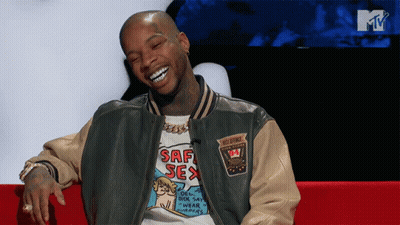 A Man Wearing A Shirt That Says Saf Sex Is Smiling GIF