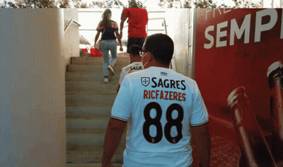 A Man Wearing A Shirt That Says Sagres Riccazeres GIF