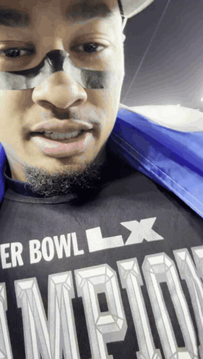 A Man Wearing A Shirt That Says Super Bowl Lx On It GIF