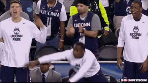 A Man Wearing A Shirt That Says Uconn Pride GIF