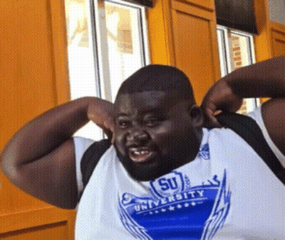 A Man Wearing A Shirt That Says University On It GIF