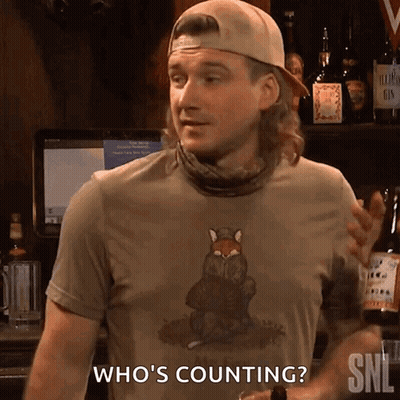 A Man Wearing A Shirt That Says ' Who 'S Counting ' GIF