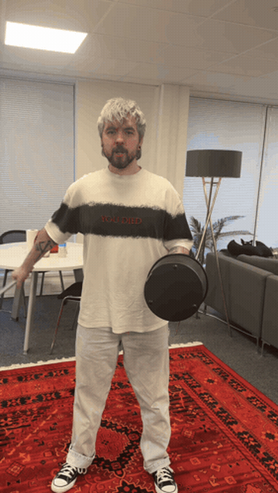 A Man Wearing A Shirt That Says You Died Holds A Black Object GIF