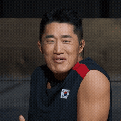 A Man Wearing A Shirt With A Korean Flag On It GIF
