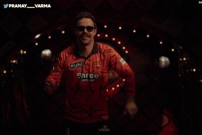 A Man Wearing A Shree Cement Shirt Is Dancing GIF