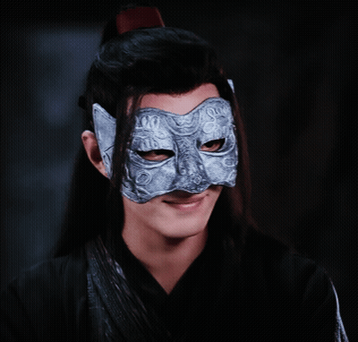 A Man Wearing A Silver Mask With A Cat Face On It GIF