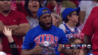 A Man Wearing A Sixers Jersey Watches A Game GIF