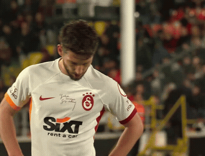 A Man Wearing A Sixt Rent A Car Jersey Looks Down GIF