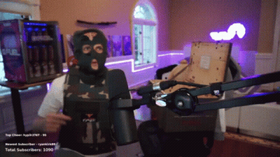 A Man Wearing A Ski Mask Stands In Front Of A Microphone With The Number 1090 In The Corner GIF