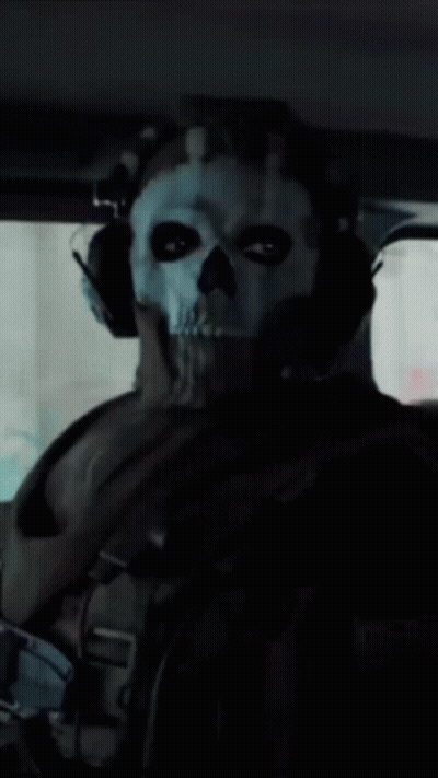 A Man Wearing A Skull Mask And Headphones Is Sitting In A Car GIF