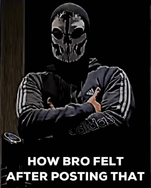 A Man Wearing A Skull Mask Is Standing With His Arms Crossed . GIF