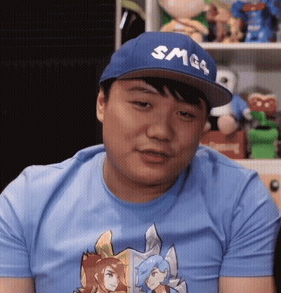A Man Wearing A Smg4 Hat And A Blue Shirt GIF
