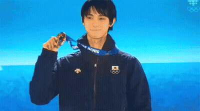 A Man Wearing A Sochi Jacket Holds A Medal Around His Neck GIF