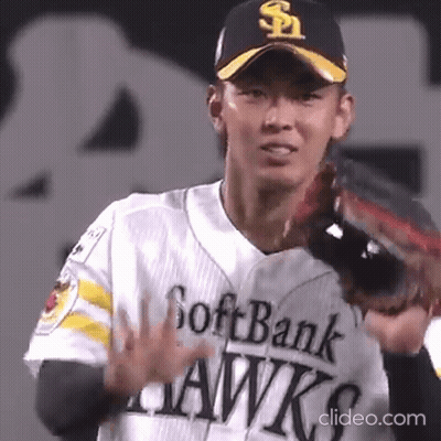 A Man Wearing A Softbank Hawks Jersey Holds Up His Hand GIF