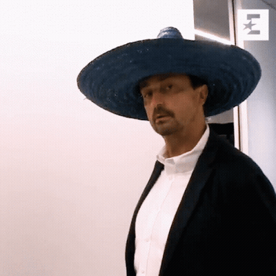 A Man Wearing A Sombrero And A Black Jacket GIF