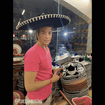 A Man Wearing A Sombrero And A Pink Shirt With @Pedrolambertini Written On It GIF