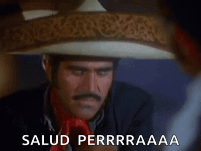 A Man Wearing A Sombrero Is Drinking A Glass Of Water And Says Salud Perrraaaa . GIF