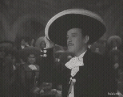 A Man Wearing A Sombrero Says Que Me Maten De Una Vez In A Black And White Photo GIF