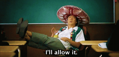A Man Wearing A Sombrero Sits In A Classroom With The Words " I 'Ll Allow It " Below Him GIF