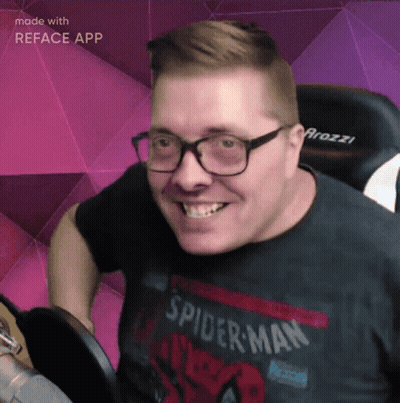 A Man Wearing A Spider-Man Shirt Is Smiling GIF