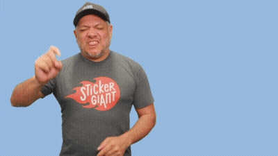 A Man Wearing A Sticker Giant Shirt Stands In Front Of A Blue Background GIF