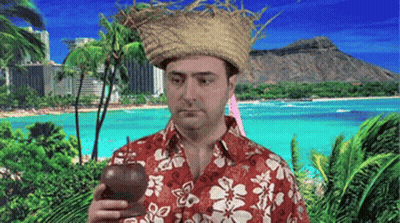 A Man Wearing A Straw Hat And A Hawaiian Shirt Is Holding A Bottle In Front Of A Beach GIF
