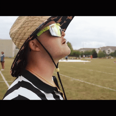 A Man Wearing A Straw Hat And Pittsburgh Sunglasses Looks Up GIF