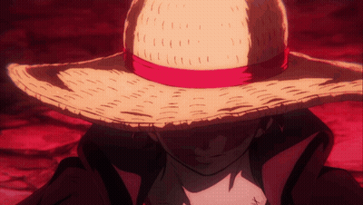 A Man Wearing A Straw Hat With A Red Ribbon Around It GIF