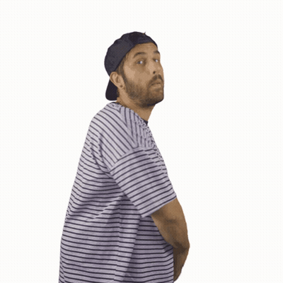 A Man Wearing A Striped Shirt And A Hat Is Making A Heart Shape With His Hands GIF