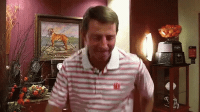 A Man Wearing A Striped Shirt With The Letter W On The Front GIF